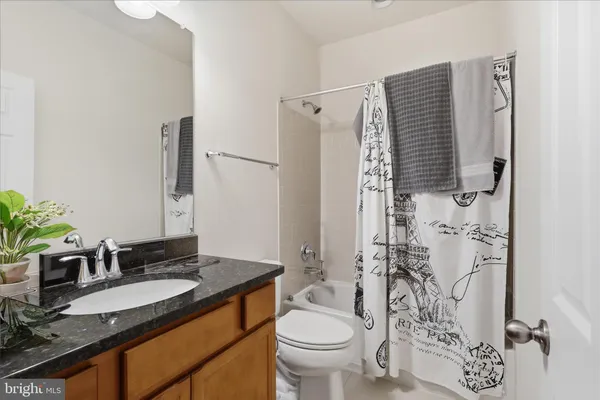 a view of a room with wooden floor and window