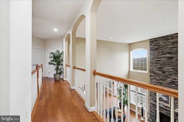 a view of a room with wooden floor and window
