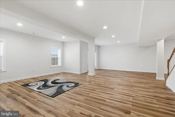 a balcony with table and chairs