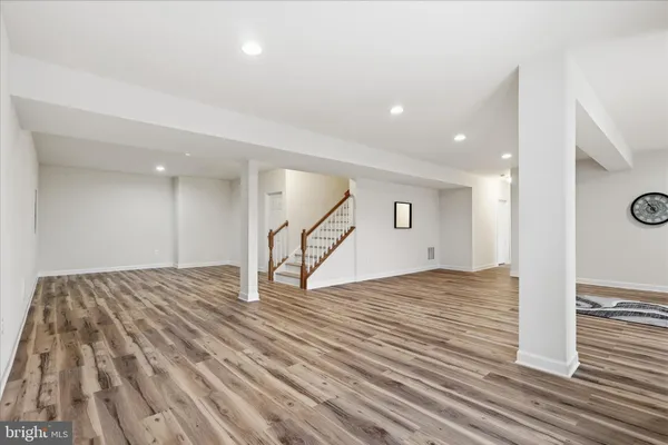 a view of balcony with wooden floor and outdoor seating
