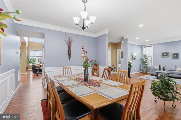 a large kitchen with lots of counter space wooden floor and appliances