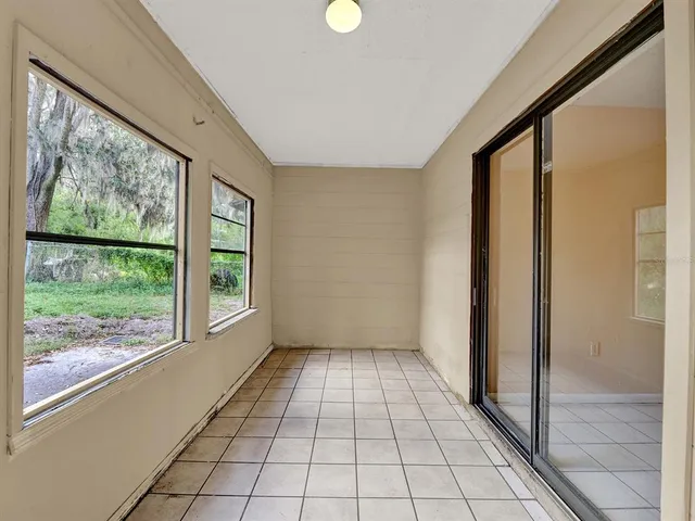 a view of an empty room and window