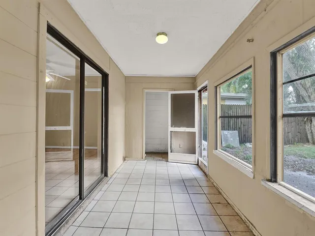 a view of an entryway with a floor to ceiling window