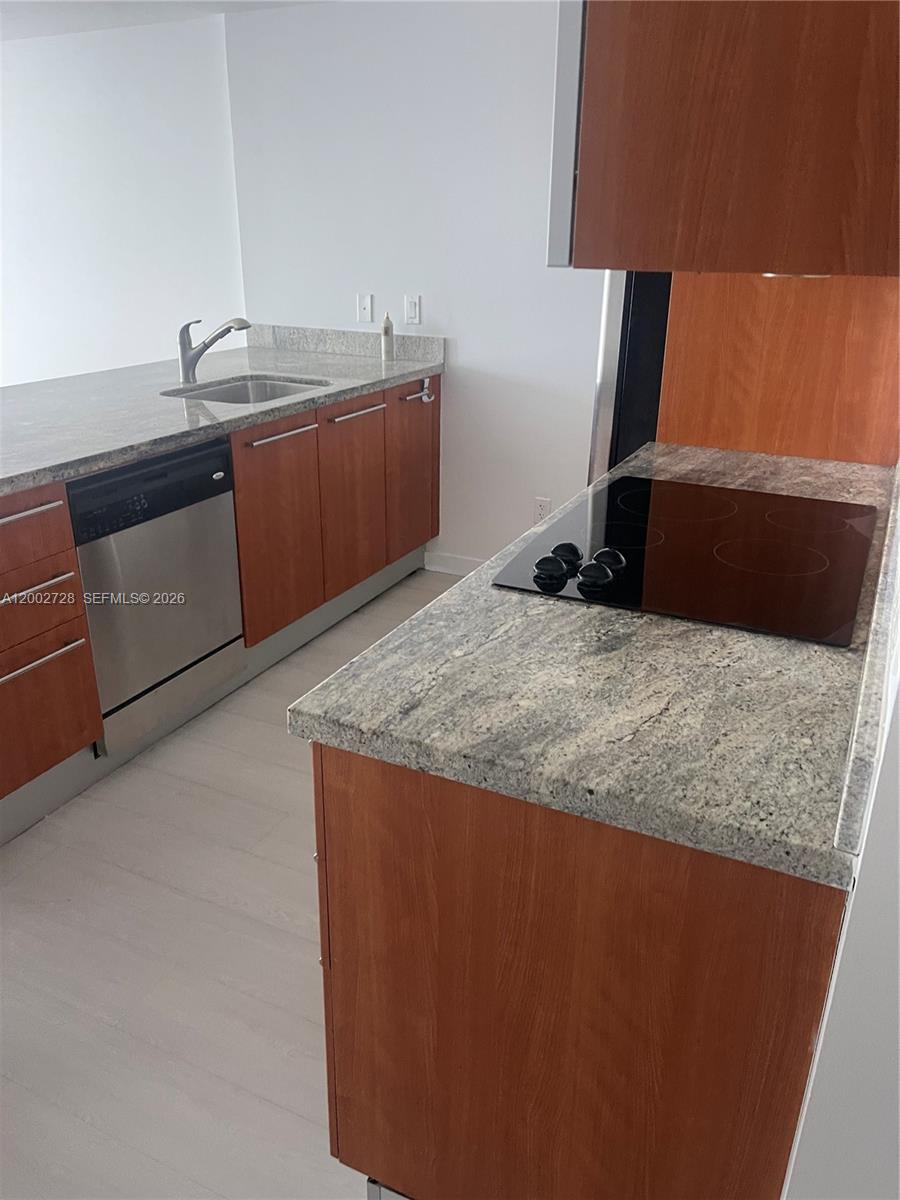 185 Southwest 7th Street, Unit 2705 Miami, FL 33130 - Photo 3 of 5 a view of a kitchen with a sink