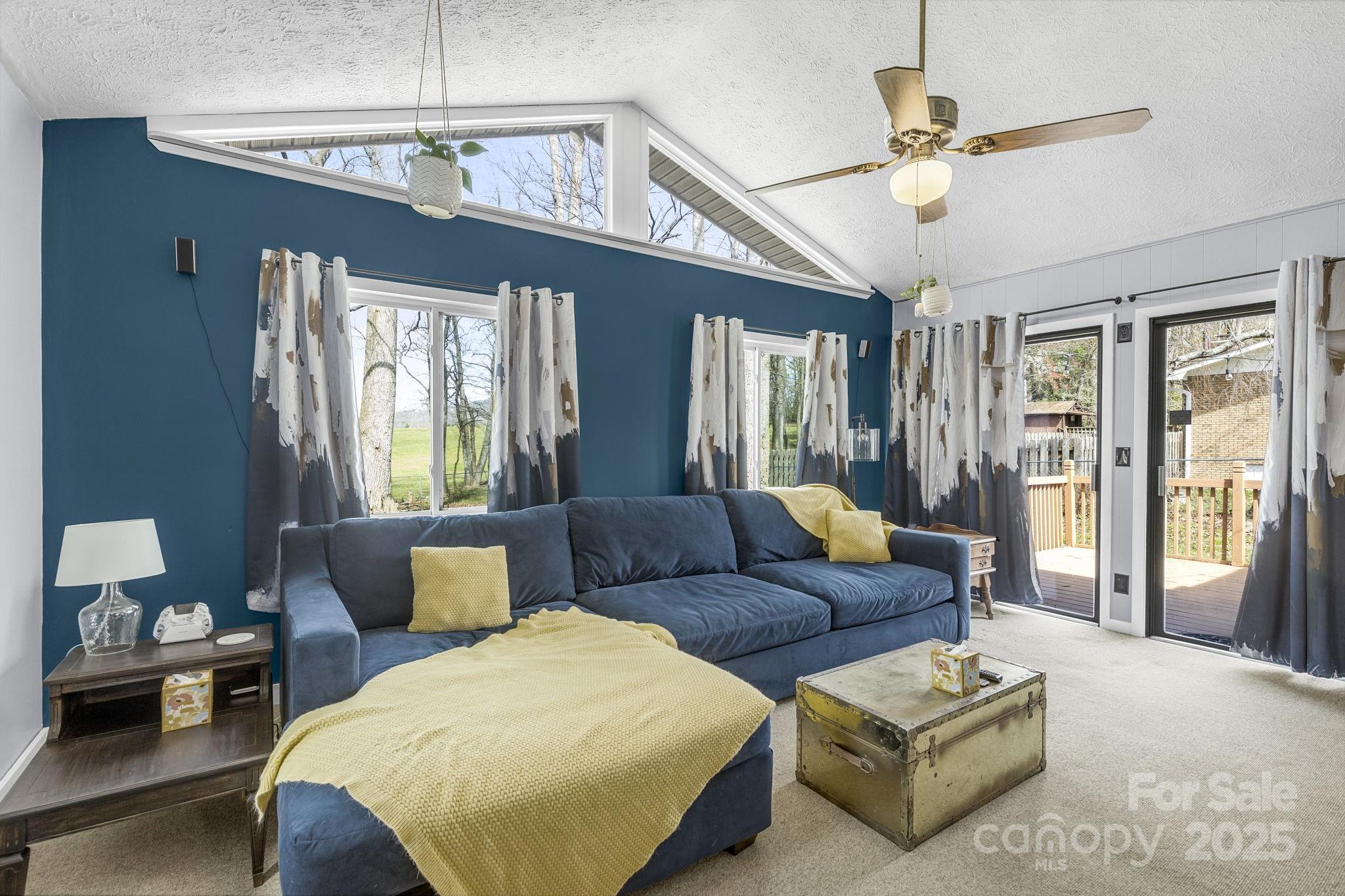 110 Cannon Drive Hendersonville, NC 28792 - Photo 17 of 36 a living room with furniture and a chandelier