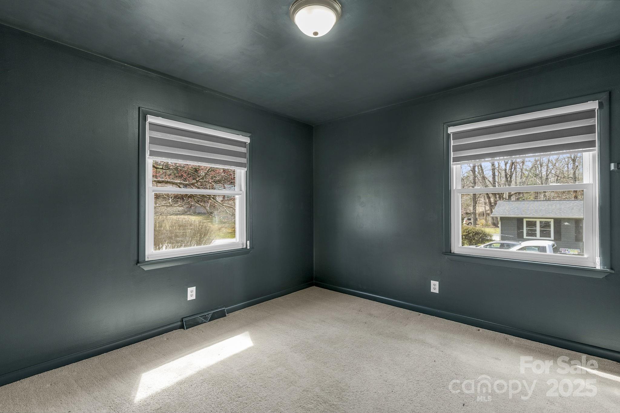 110 Cannon Drive Hendersonville, NC 28792 - Photo 25 of 36 a view of an empty room with a window