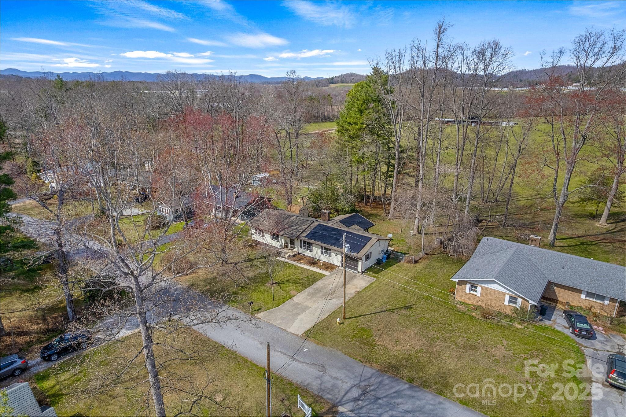 110 Cannon Drive Hendersonville, NC 28792 - Photo 32 of 36 a view of a swimming pool with a patio