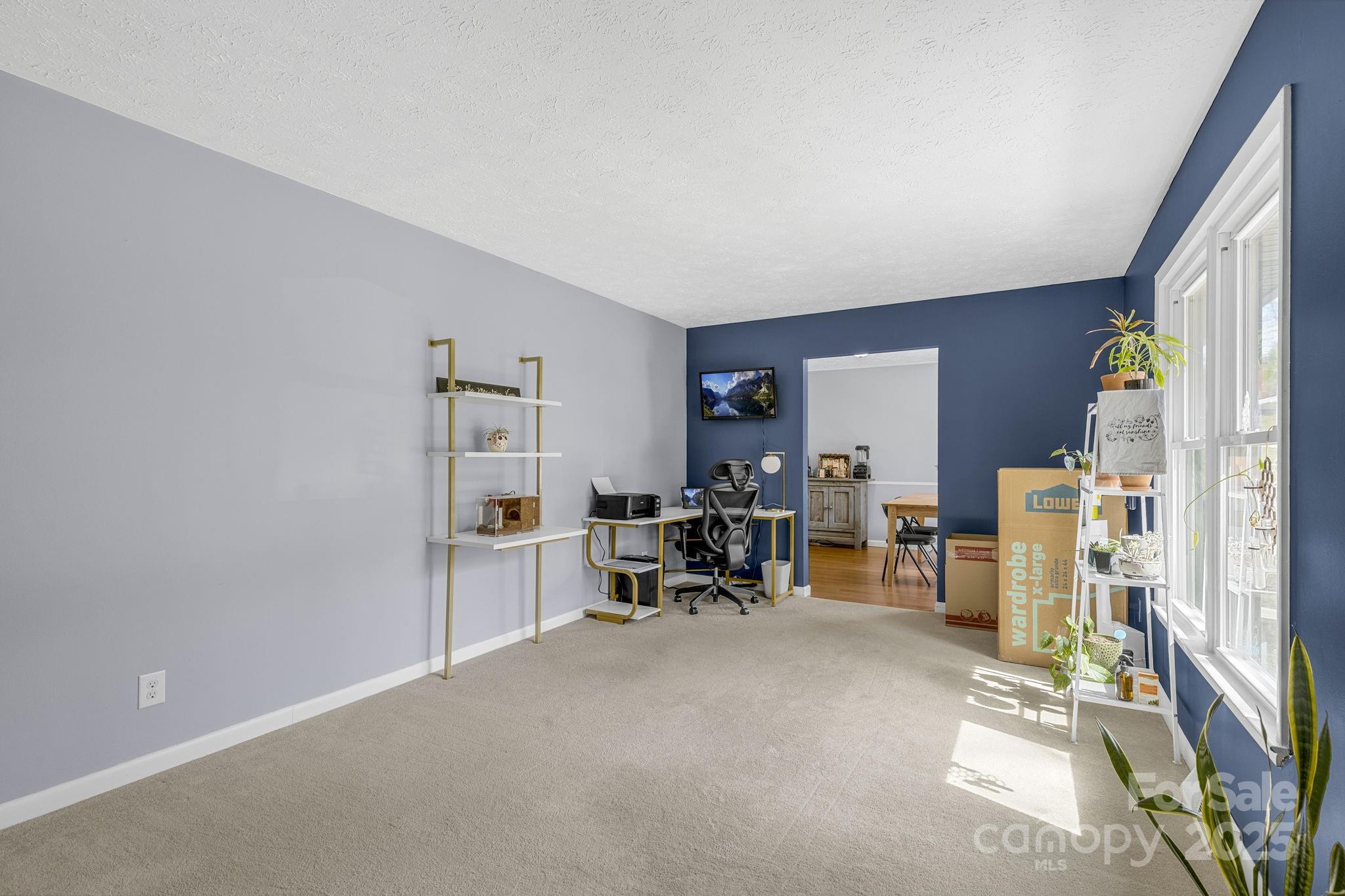 110 Cannon Drive Hendersonville, NC 28792 - Photo 6 of 36 a view of a livingroom with furniture and a window
