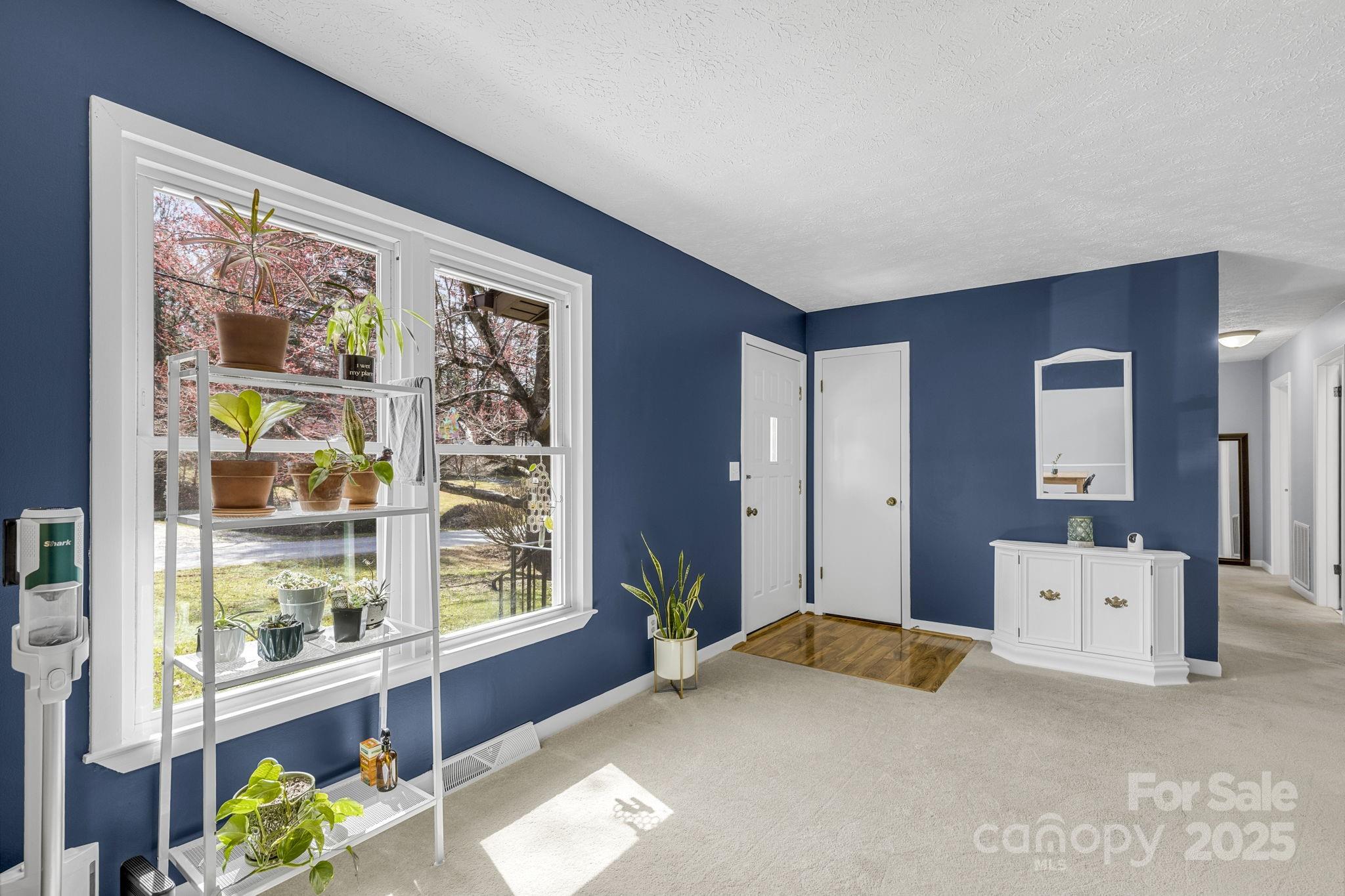 110 Cannon Drive Hendersonville, NC 28792 - Photo 7 of 36 a bed room with a bed and a large window