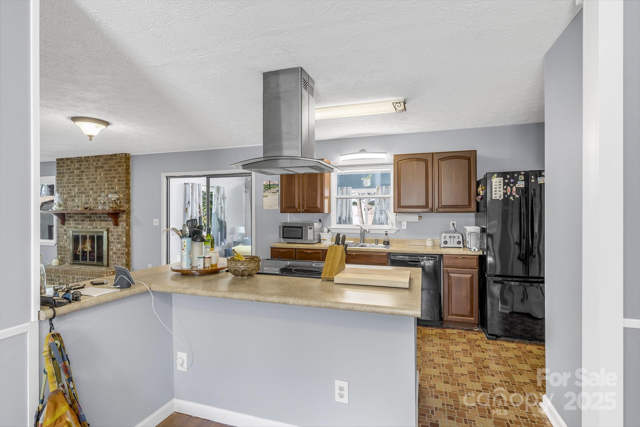 110 Cannon Drive Hendersonville, NC 28792 - Photo 10 of 36 a kitchen with stainless steel appliances a sink stove and refrigerator