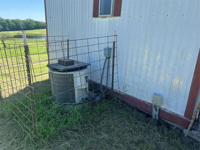 a view of a house with backyard porch and sitting area