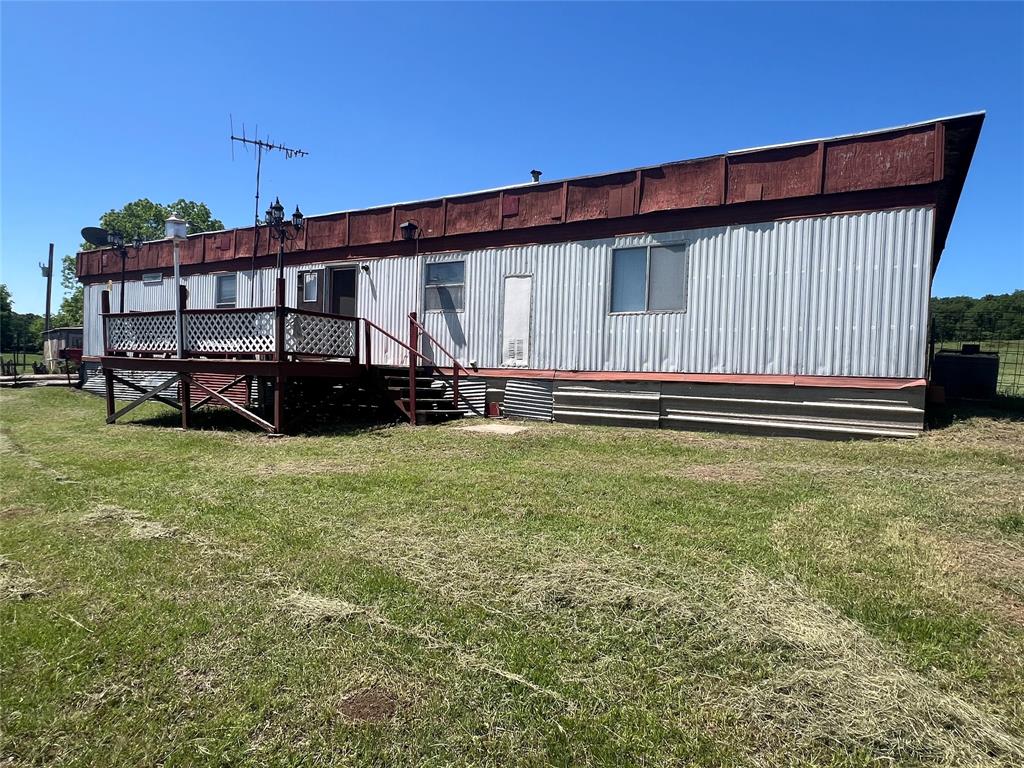 0 Holland Road Forestburg, TX 76239 - Photo 25 of 38 a front view of a house with a yard