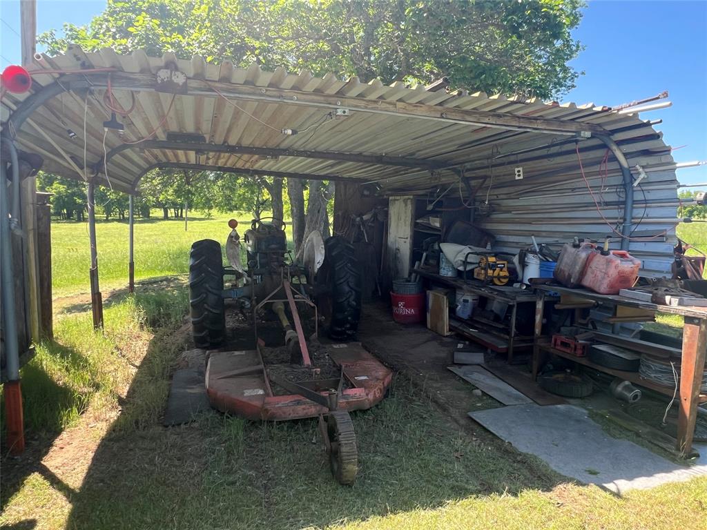 0 Holland Road Forestburg, TX 76239 - Photo 35 of 38 a room with lots of furniture and a potted plant