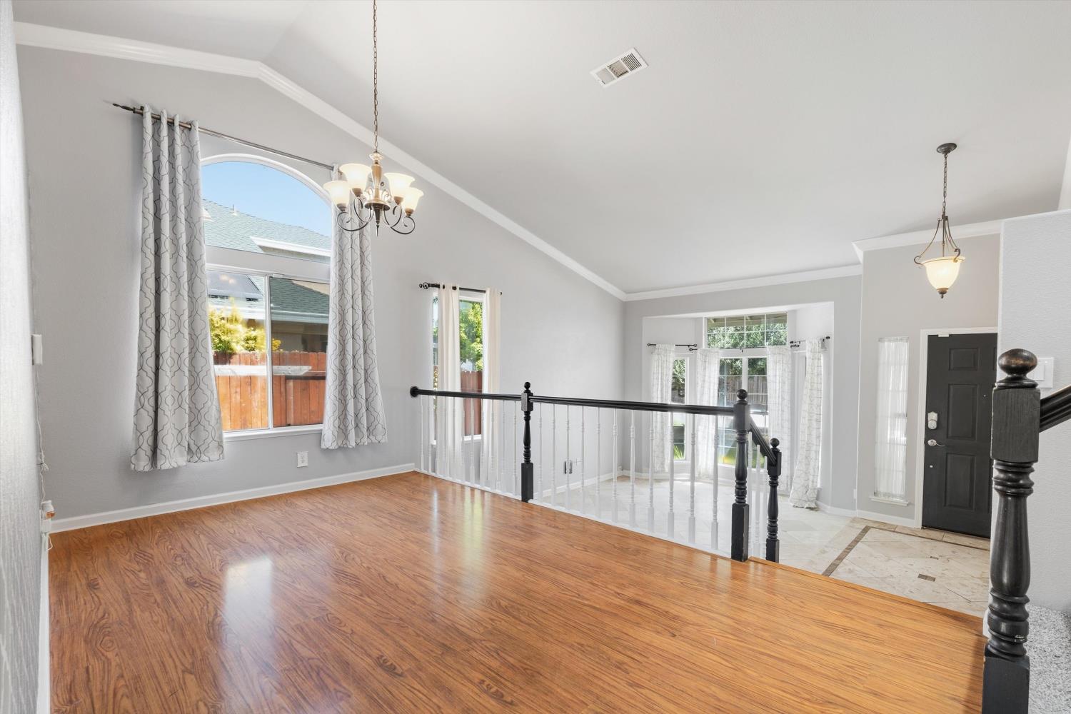 3921 Simi Valley Way Antelope, CA 95843 - Photo 7 of 34 Formal dining room with vaulted ceilings overlooking the welcoming living room and entry.