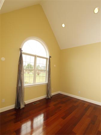 64 Osgood Road Sterling, MA 01564 - Photo 12 of 30 an empty room with wooden floor and windows