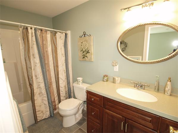 64 Osgood Road Sterling, MA 01564 - Photo 18 of 30 a bathroom with a sink a toilet and a mirror