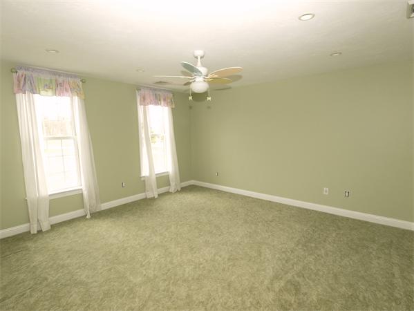 64 Osgood Road Sterling, MA 01564 - Photo 19 of 30 an empty room with a window and a fan