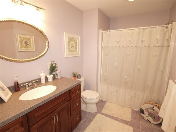 64 Osgood Road Sterling, MA 01564 - Photo 21 of 30 a bathroom with a sink a toilet and a mirror
