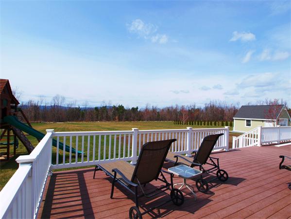 64 Osgood Road Sterling, MA 01564 - Photo 24 of 30 a view of a balcony with wooden floor and outdoor seating