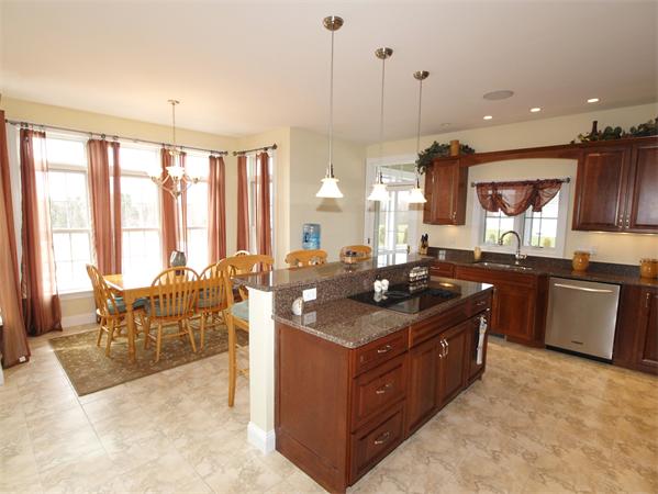 64 Osgood Road Sterling, MA 01564 - Photo 5 of 30 a large kitchen with kitchen island a large counter top space a sink stainless steel appliances and cabinets
