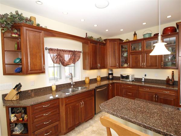 64 Osgood Road Sterling, MA 01564 - Photo 6 of 30 a kitchen with a sink stove and cabinets