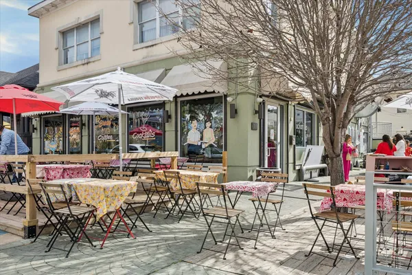 a view of a cafe with sitting area