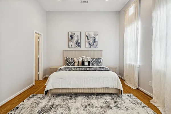 a bedroom with a bed and a window