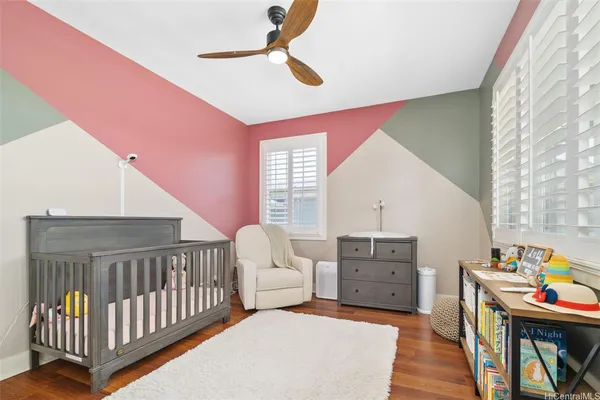 a bedroom with furniture and a window