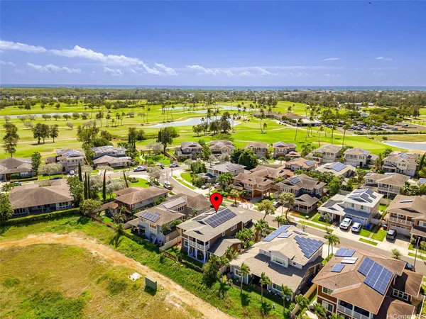 an aerial view of residential houses with outdoor space