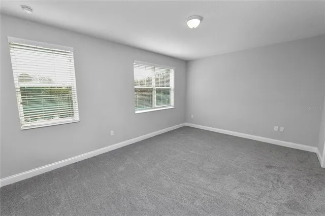 a bathroom with a shower a toilet and a shower