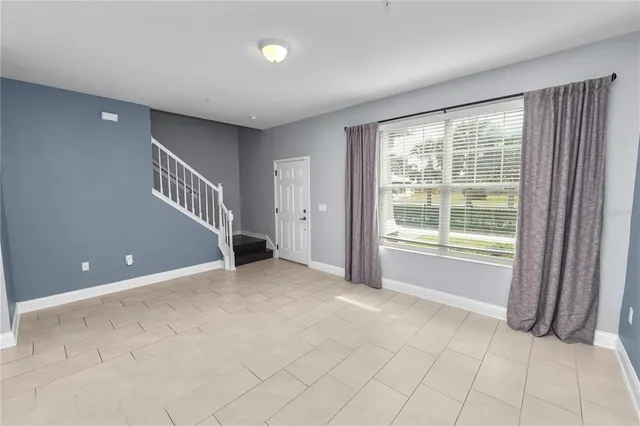 a kitchen with granite countertop stainless steel appliances and wooden cabinets