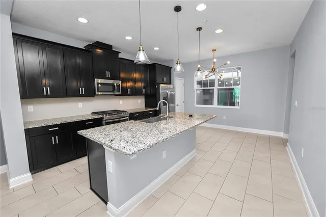 a view of a kitchen with a dishwasher cabinets and refrigerator