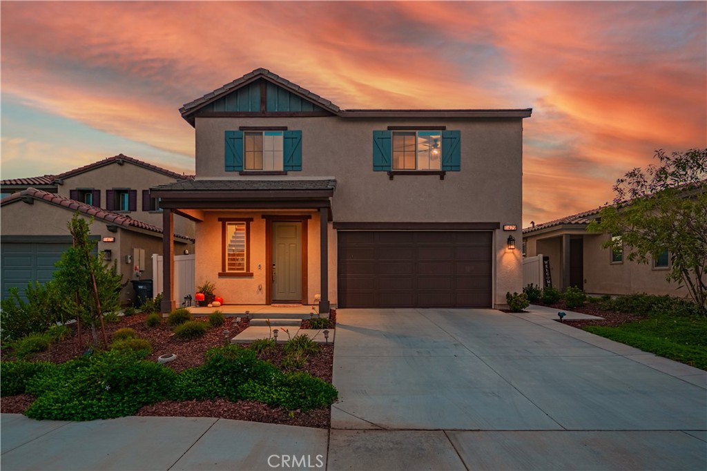 11479 Sheridan Way Beaumont, CA 92223 - Photo 1 of 40 a front view of a house with a yard and garage