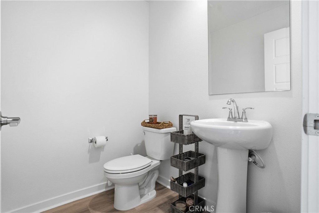 11479 Sheridan Way Beaumont, CA 92223 - Photo 12 of 40 a bathroom with a sink a toilet and mirror