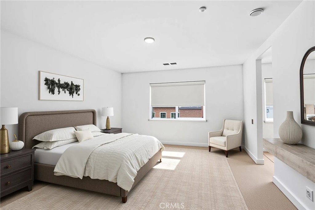 11479 Sheridan Way Beaumont, CA 92223 - Photo 13 of 40 a bedroom with a bed and a couch