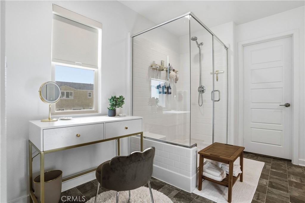 11479 Sheridan Way Beaumont, CA 92223 - Photo 14 of 40 a bathroom with a sink a mirror and a shower