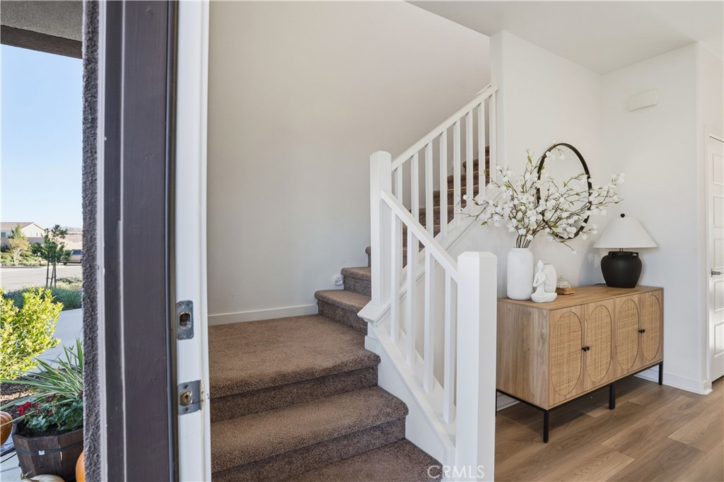 11479 Sheridan Way Beaumont, CA 92223 - Photo 3 of 40 a view of entryway livingroom and hall with wooden floor