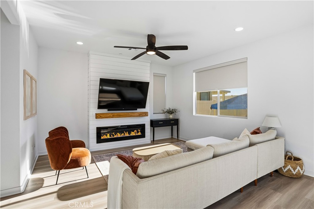 11479 Sheridan Way Beaumont, CA 92223 - Photo 5 of 40 a living room with furniture and a flat screen tv