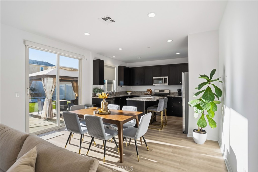 11479 Sheridan Way Beaumont, CA 92223 - Photo 8 of 40 a view of a dining room with furniture