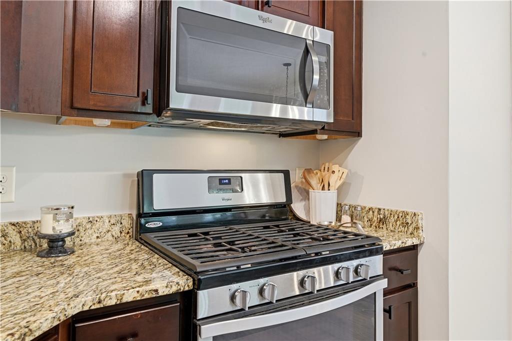 302 Spence Circle Ball Ground, GA 30107 - Photo 18 of 55 a stove top oven sitting inside of a kitchen