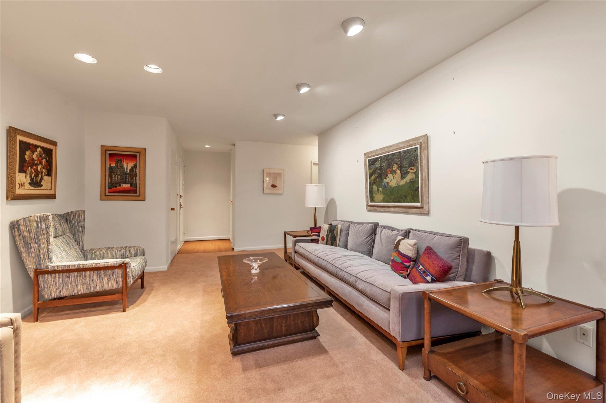 30 Barstow Road, Unit 3A Great Neck, NY 11021 - Photo 3 of 17 a living room with furniture