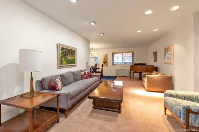 a view of a livingroom with furniture and a chandelier