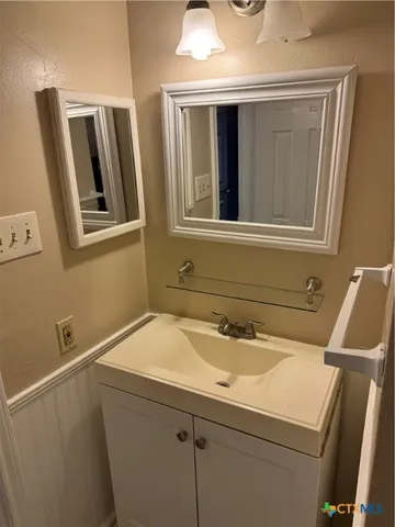 a bathroom with a sink and a toilet