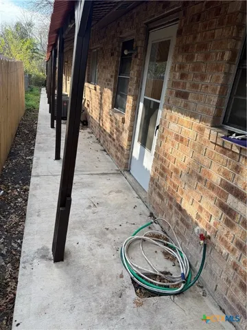 a view of a porch of a house