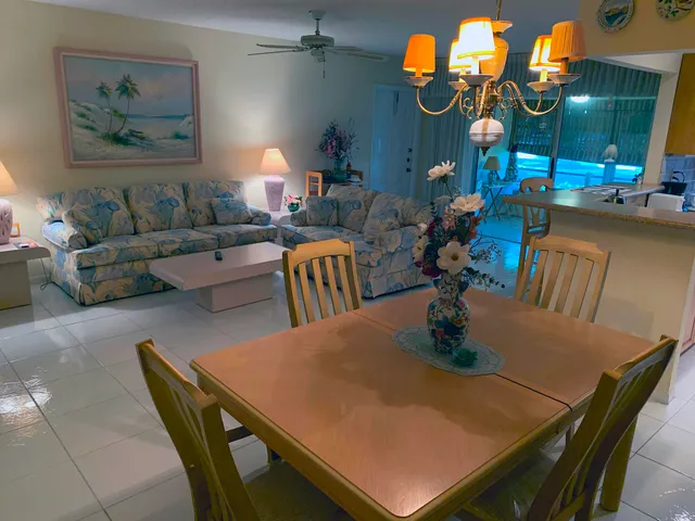 a dining room with furniture and wooden floor