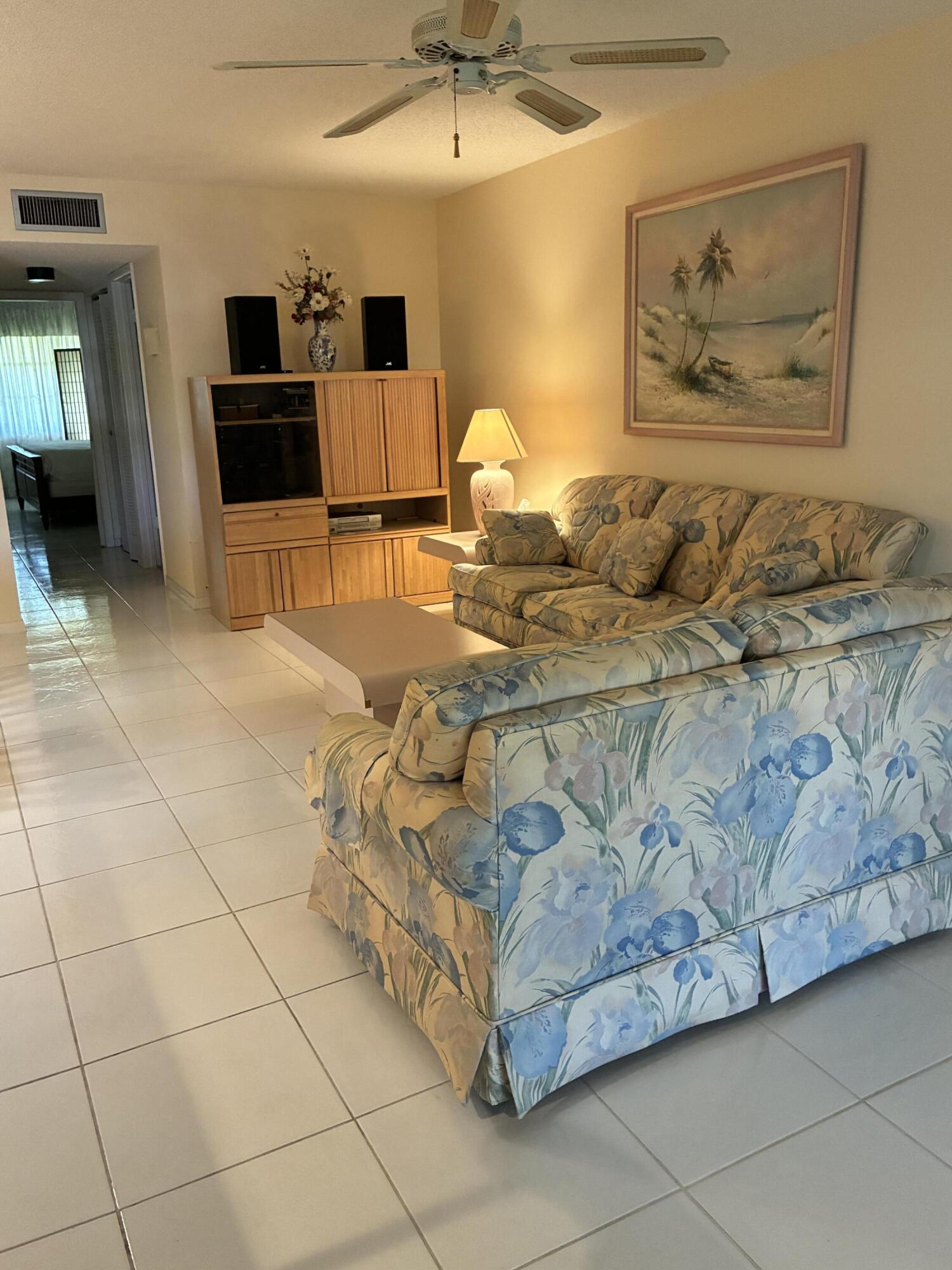 4540 Northwest 3rd Court, Unit C Delray Beach, FL 33445 - Photo 13 of 29 a bedroom with a bed and a view of bathroom