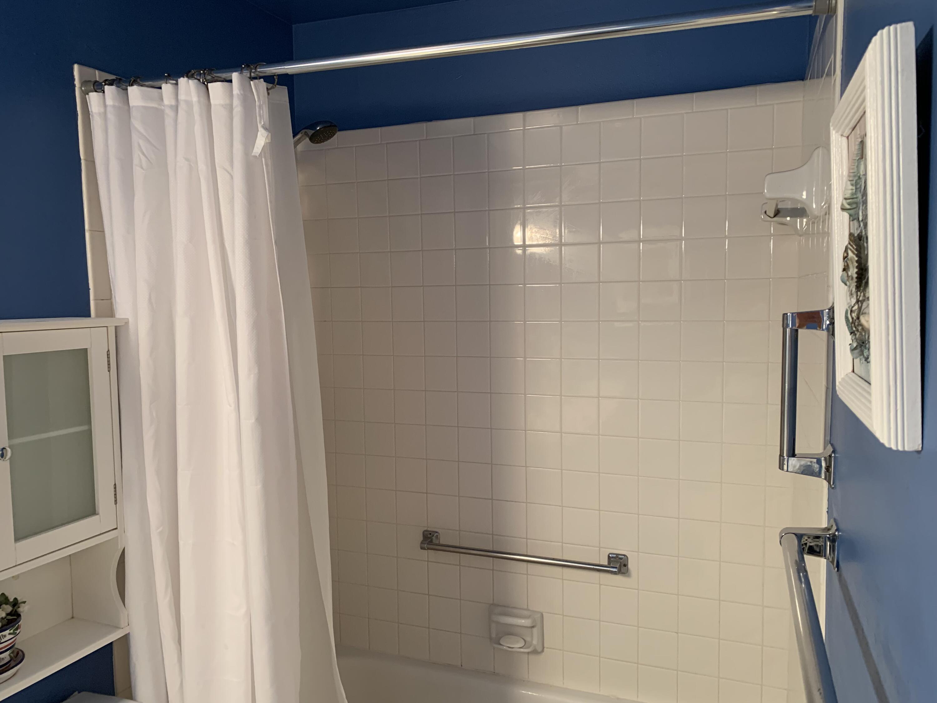 4540 Northwest 3rd Court, Unit C Delray Beach, FL 33445 - Photo 21 of 29 a bathroom with a shower