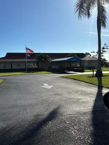 a view of a house and a big yard