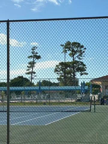 a view of a big yard with a lake view