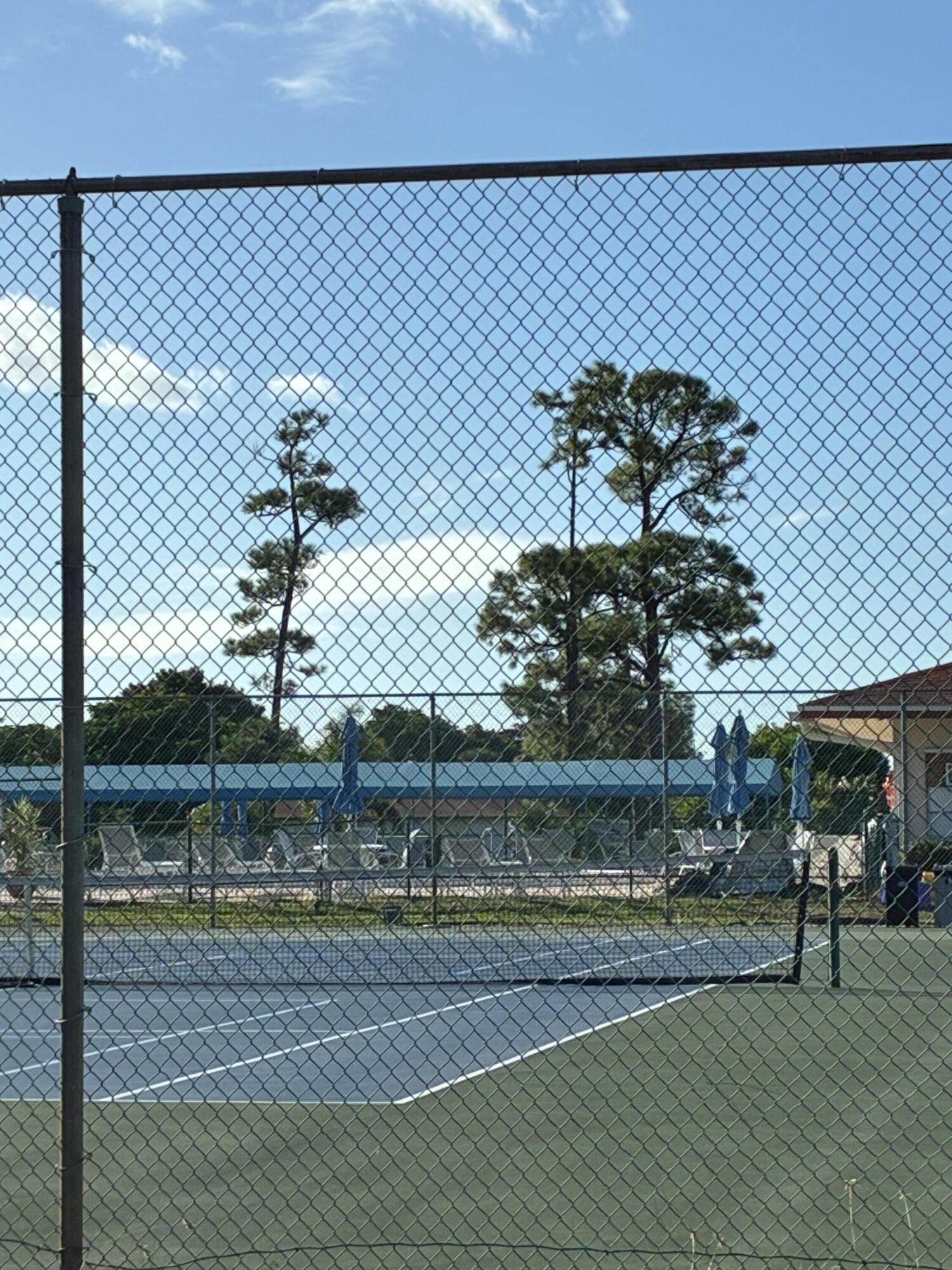 4540 Northwest 3rd Court, Unit C Delray Beach, FL 33445 - Photo 27 of 29 a view of a tennis court
